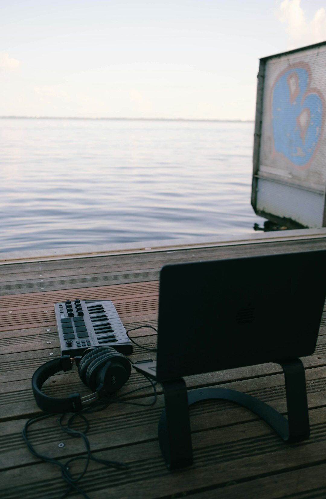 Croatian audio producer editing a podcast episode on a laptop in a studio