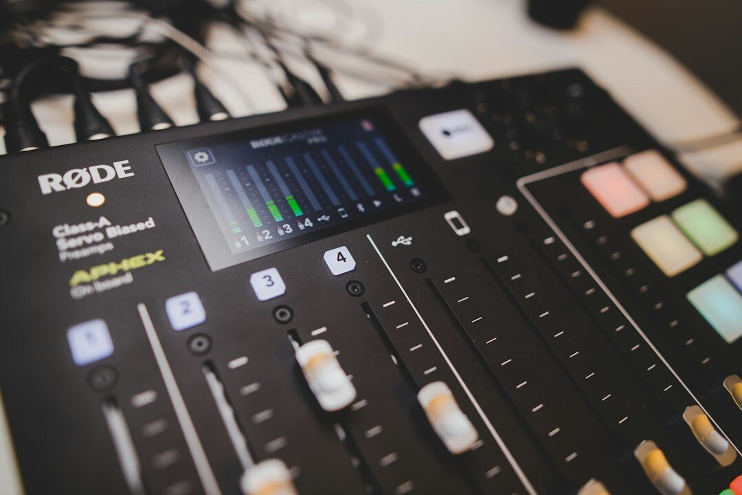 Close-up of a professional podcast microphone and mixing console