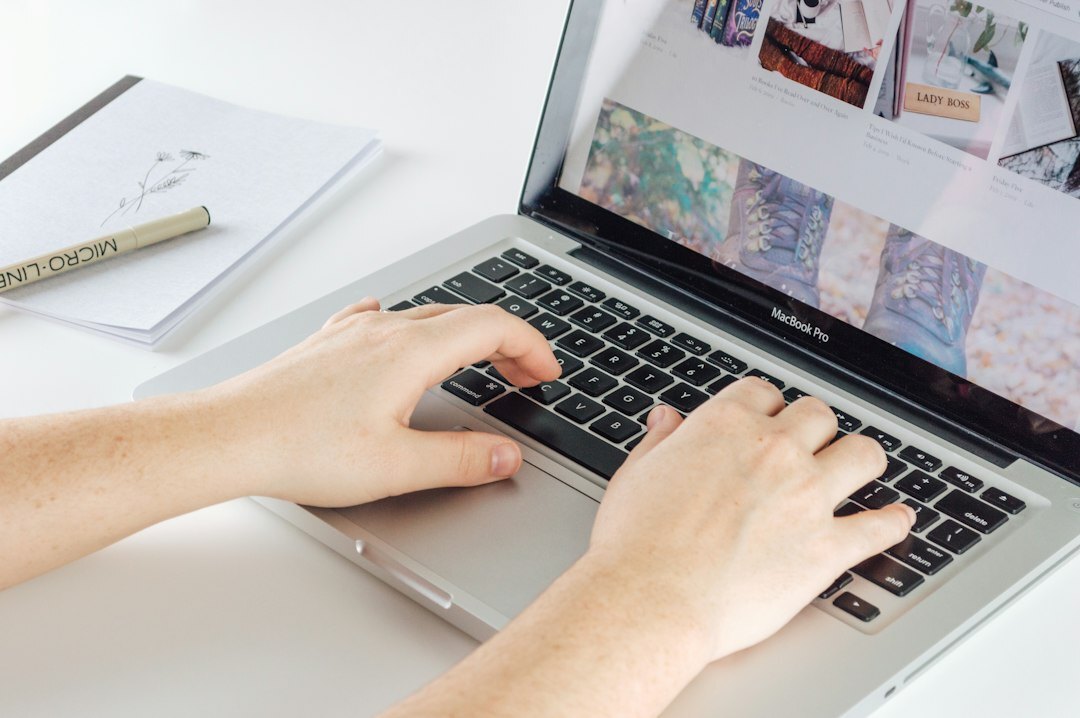 blogger typing on laptop