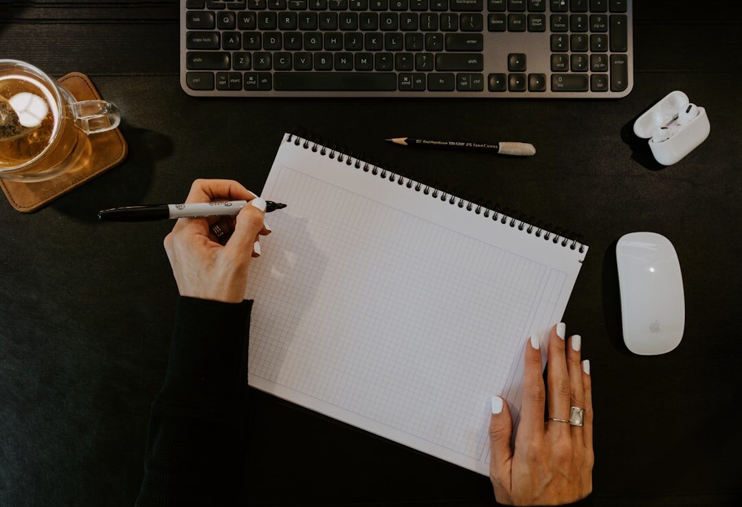 blogger writing at desk
