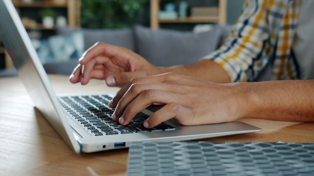blogger typing on laptop